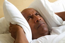 Man with Pillow Over Ears Man with Pillow Over Ears