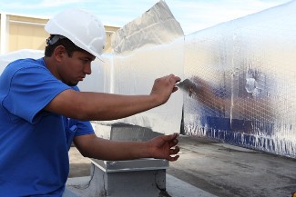 Man Installing Insulation